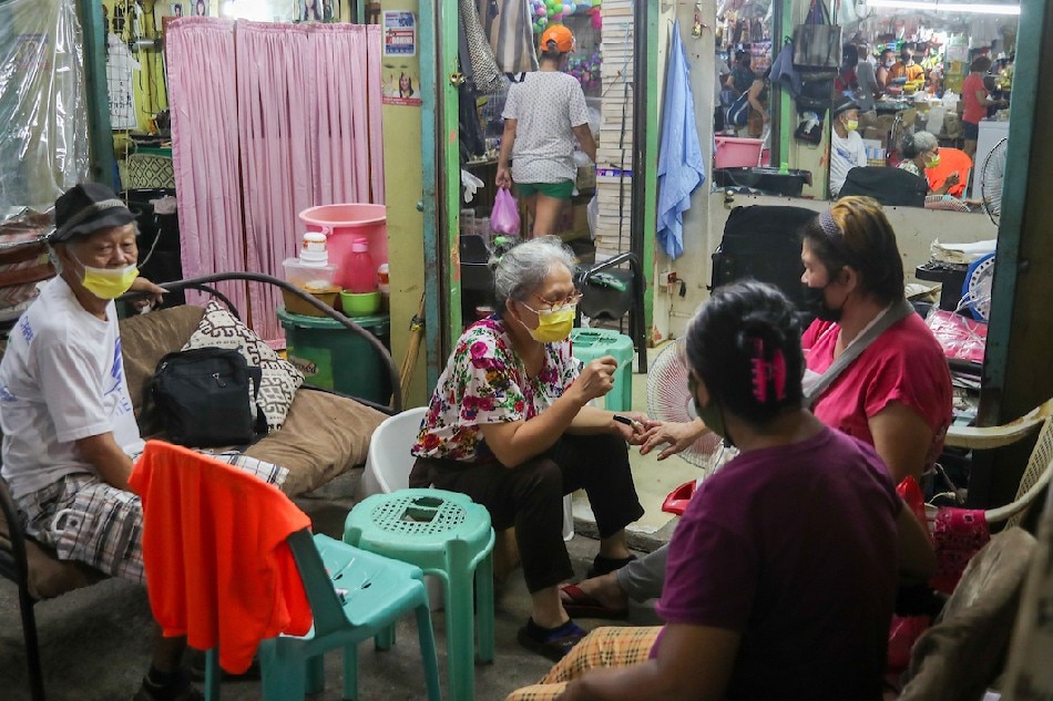 Senior citizens gather at a salon inside the Tandang Sora Market in Qezon City on June 16, 2021. Jonathan Cellona, ABS, CBN News/File 