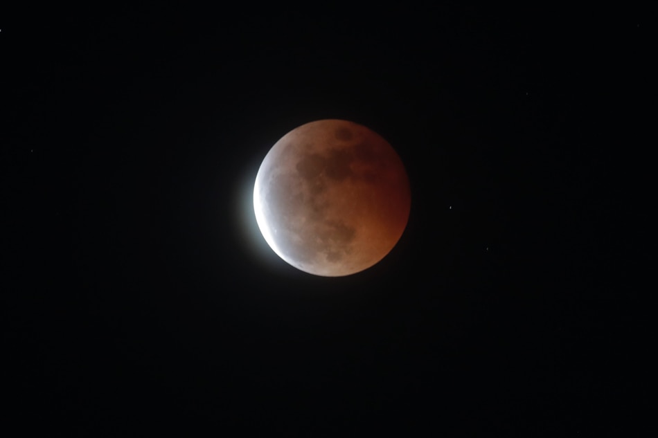Look up: Filipinos grab a peek of blood moon 11