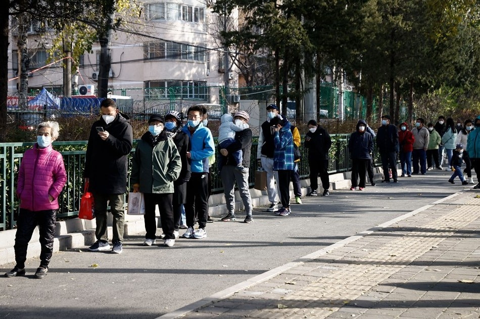People line up for a COVID-19 test in Beijing, China, on November 26, 2022. Mark R. Cristino, EPA-EFE