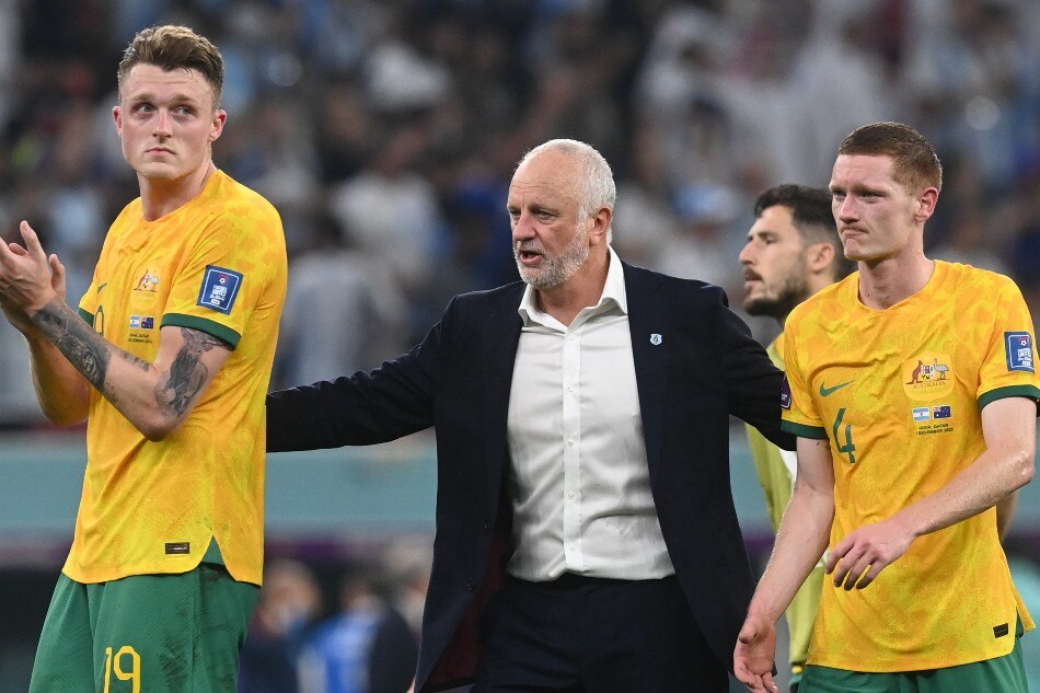 Head coach Graham Arnold (C) of Australia consoles his players Kye Rowles (R) and Harry Souttar after the FIFA World Cup 2022 round of 16 soccer match between Argentina and Australia at Ahmad bin Ali Stadium in Doha, Qatar, 03 December 2022. Neil Hall, EPA-EFE.