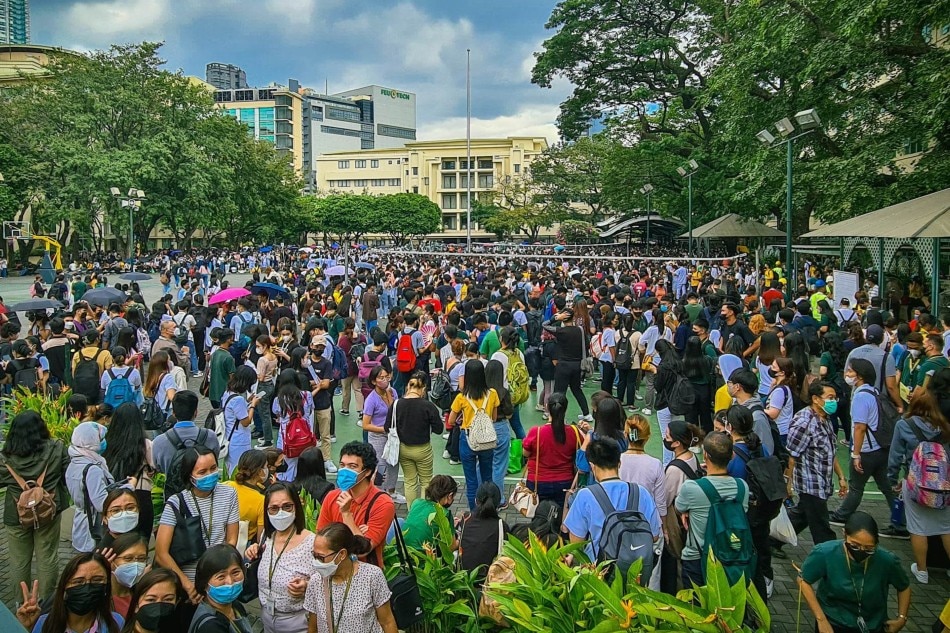 FEU students who evacuated their buildings following the quake gathered at the open-air grandstand portion of the school, many opening their umbrellas against the afternoon heat. FEU