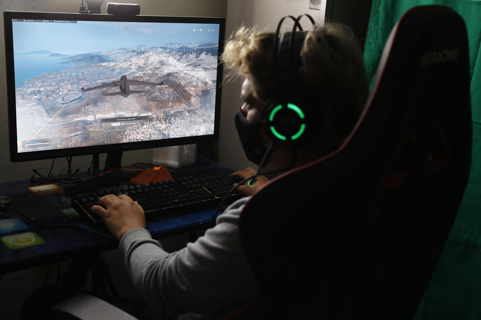  Mikhail Huacan plays Call of Duty Warzone online with other Latin American players, from his home in Lima, Peru in this October 2020 file photo. Paolo Aguilar, EPA-EFE