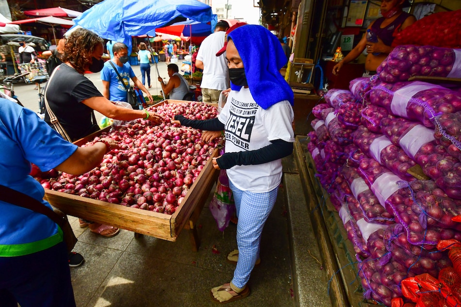  Red onions go for sale in a market in Manila on October 12, 2022. Mark Demayo, ABS-CBN News