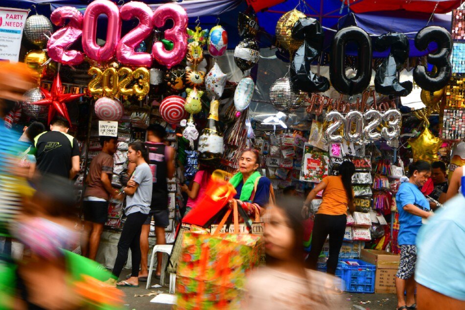New Year balloon decorations are being sold at a market in Manila on Dec. 26, 2022. Mark Demayo, ABS-CBN News