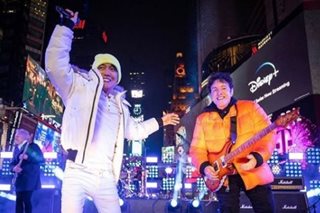 Journey performs at Times Square to ring in New Year