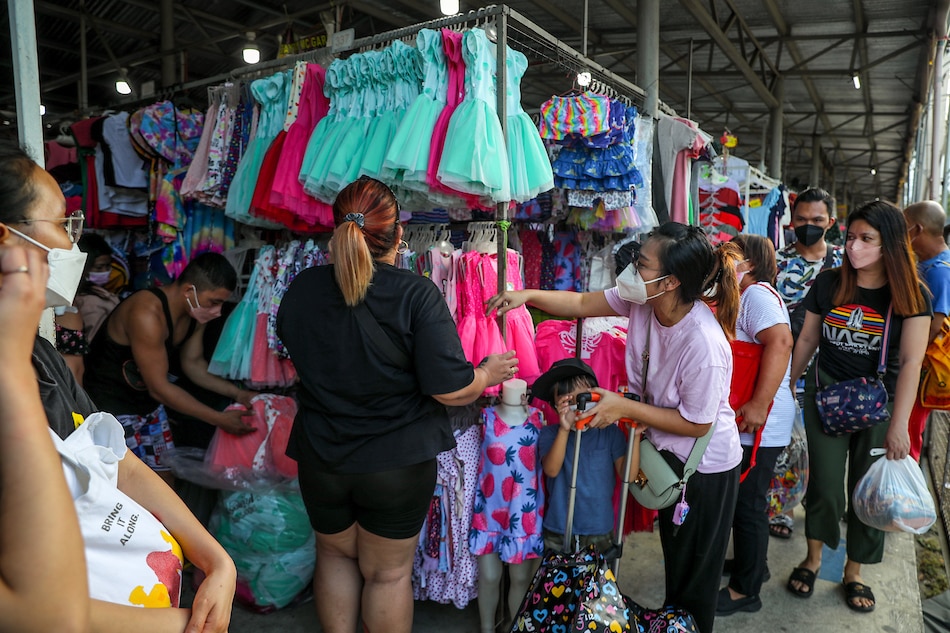 People flock to a clothing bazaar at the Taytay Rizal Market on December 13, 2021. With barely two weeks before Christmas day, people are rushing to buy gifts for their loved ones to follow the gift-giving tradition of the holidays. Jonathan Cellona, ABS-CBN News