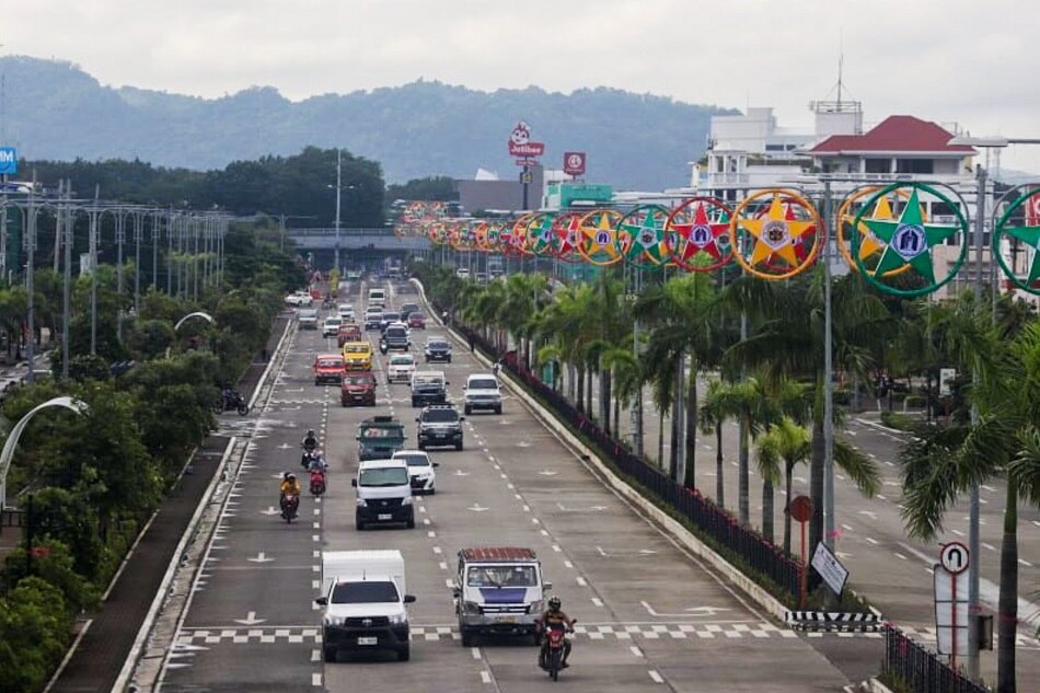 Cars traverse Benigno Aquino Avenue in Mandurriao, Brgy. San Rafael in Iloilo City. Arnold Almacen, Iloilo City Mayor's Office/File