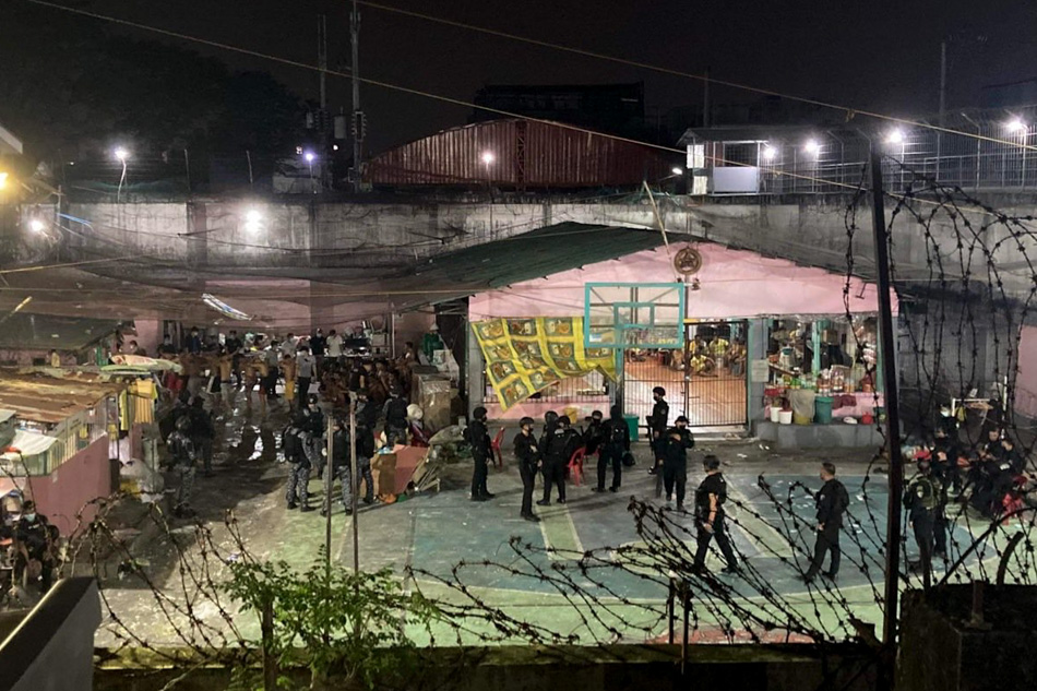 Members of the Police Special Tactics and Response Team arrive at the Caloocan City Jail on Jan. 10, 2022 after a riot between two groups of PDLs erupted. Bureau of Jail Management and Penology-National Capital Region handout