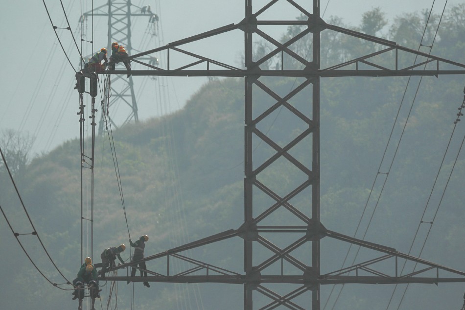 The Line of Duty. Line-men work on cleaning powerlines. Jonathan Cellona, ABS-CBN News/File