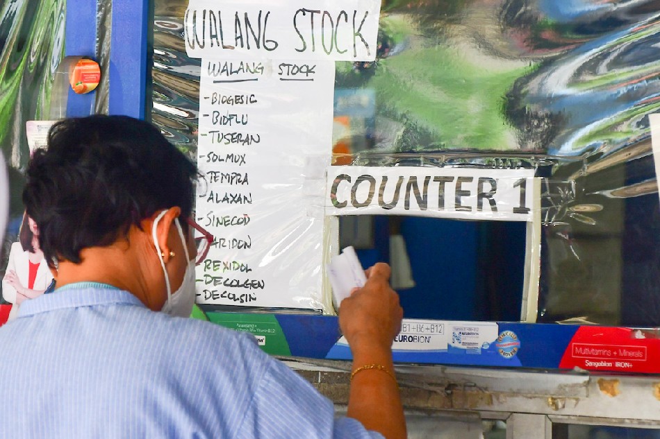 A drugstore in Manila puts up a list of unavailable over-the-counter medicines on Jan. 4, 2022 as supplies run short with people stacking up on common medicines for fever, cough and colds associated with COVID-19 sickness. Mark Demayo, ABS-CBN News