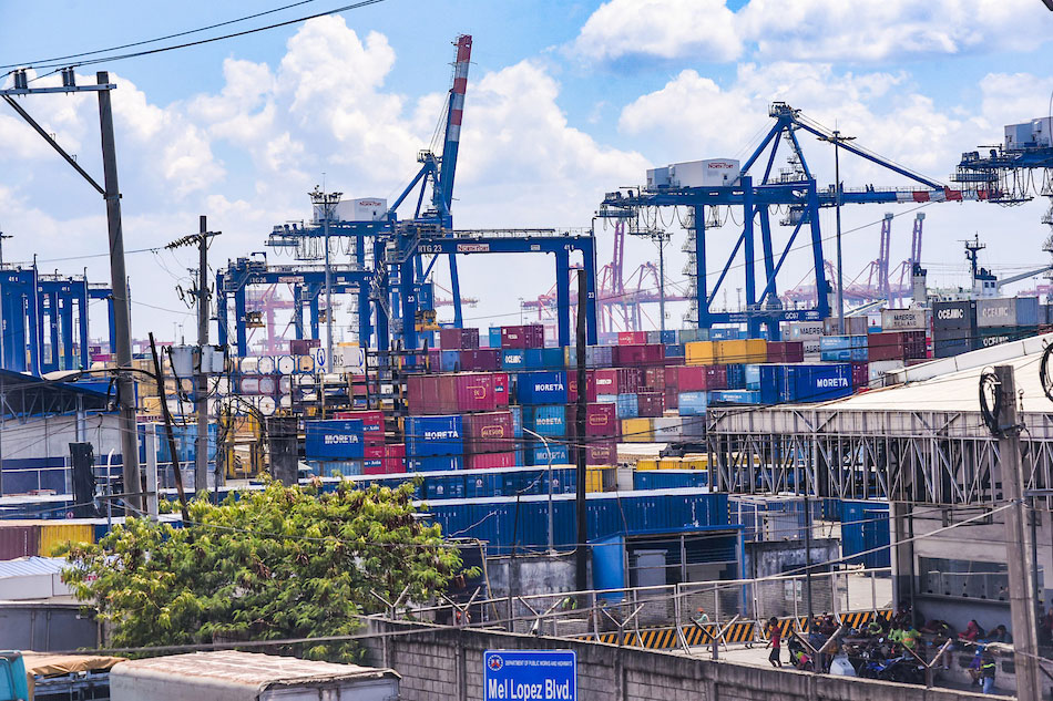  Container vans stacked together are seen inside the Philippine Ports Authority (PPA) compound in Manila on April 1, 2020. George Calvelo, ABS-CBN News 