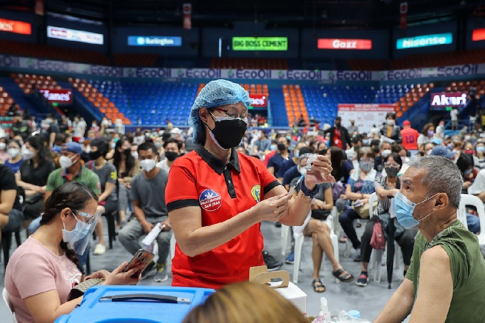 Residents receive their COVID-19 booster shots at the FilOil Arena as the City of San Juan resumes its vaccination for its residents on January 03, 2021. Jonathan Cellona, ABS-CBN News