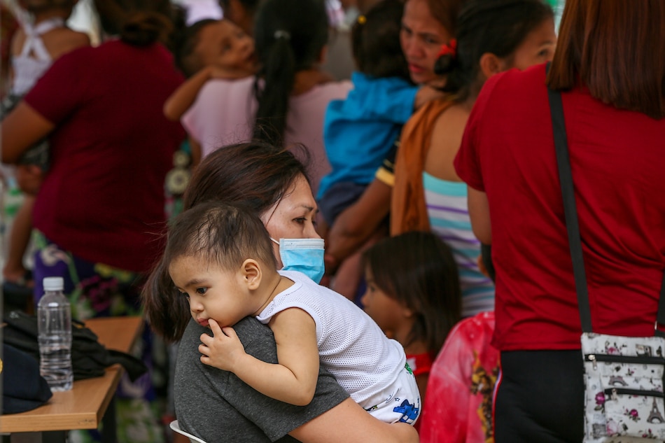Mothers bring their babies to Vaccination for babies 5 years old and below at the evacuation site at the in the Batangas Provincial gym on January 21, 2020. Jonathan Cellona, ABS-CBN News