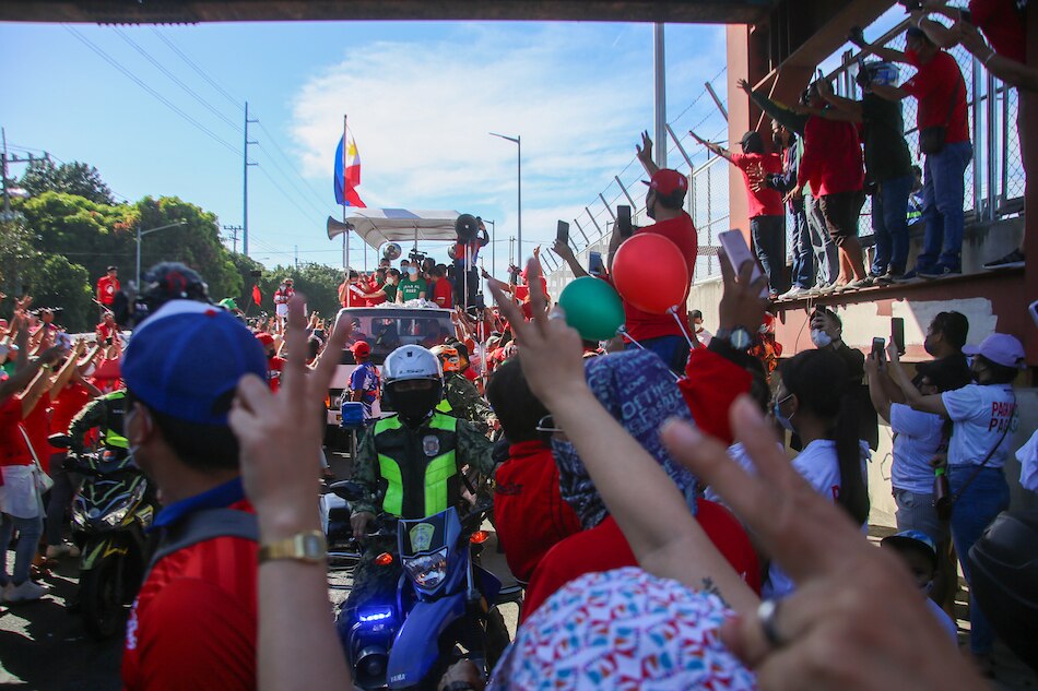 Supporters of presidential aspirant Ferdinand Marcos, Jr and running mate Davao City vice mayor Sara Duterte join the grand caravan along Commonwealth Avenue in Quezon City on December 8,2021. Jonathan Cellona, ABS-CBN News