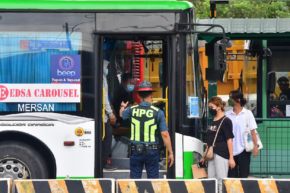 Passengers ride the EDSA Bus Carousel in Quezon City on January 26, 2022. Mark Demayo, ABS-CBN News