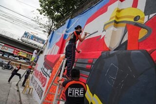 Firefighters honor their own through street art