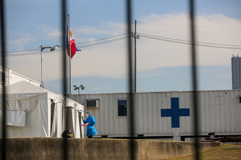 Members of the Manila Health Department (MHD) monitor patients undergoing isolation at the Manila COVID-19 Field Hospital at Rizal Park in Manila on January 17, 2022. Jonathan Cellona, ABS-CBN News/File