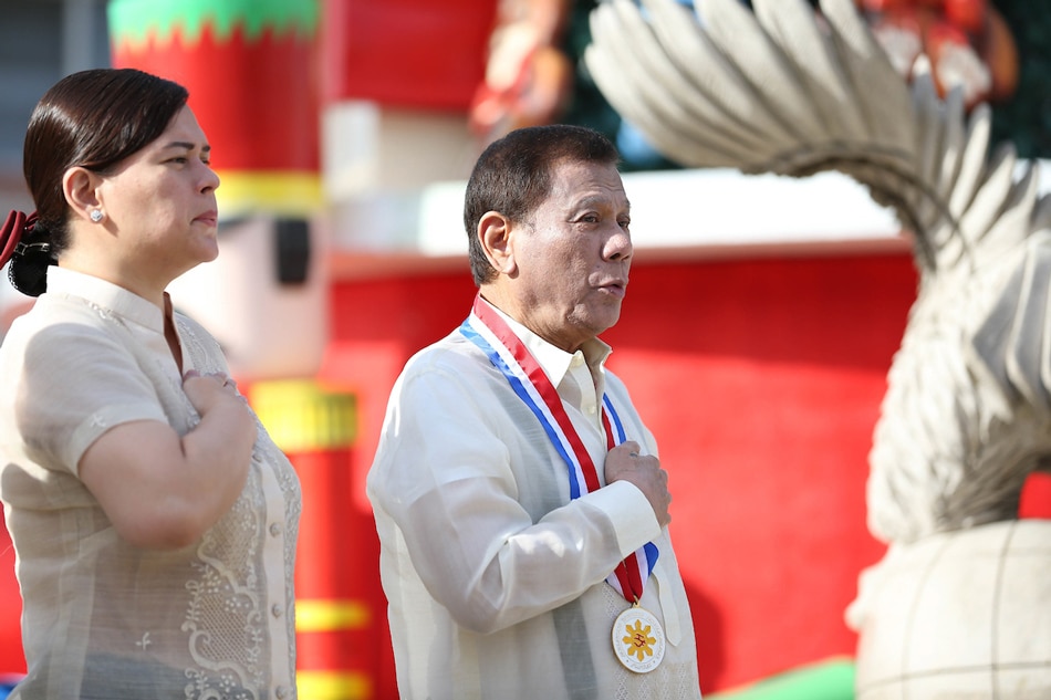 President Rodrigo Duterte sings the Philippine National Anthem during the commemoration of the 123rd Anniversary of the martyrdom of Dr. Jose Rizal at the Rizal Park in Davao City on Dec. 30, 2019. With the President is Davao City Mayor Sara Duterte-Carpio. Karl Norman Alonzo, Presidential Photo/File 