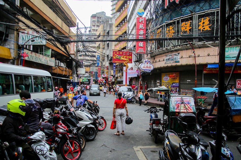 People visit shops along Binondo, Manila on Chinese New Year, February 1, 2022 as Metro Manila is put under the looser Alert Level 2 restriction with COVID-19 cases declining steadily. Jonathan Cellona, ABS-CBN News/File