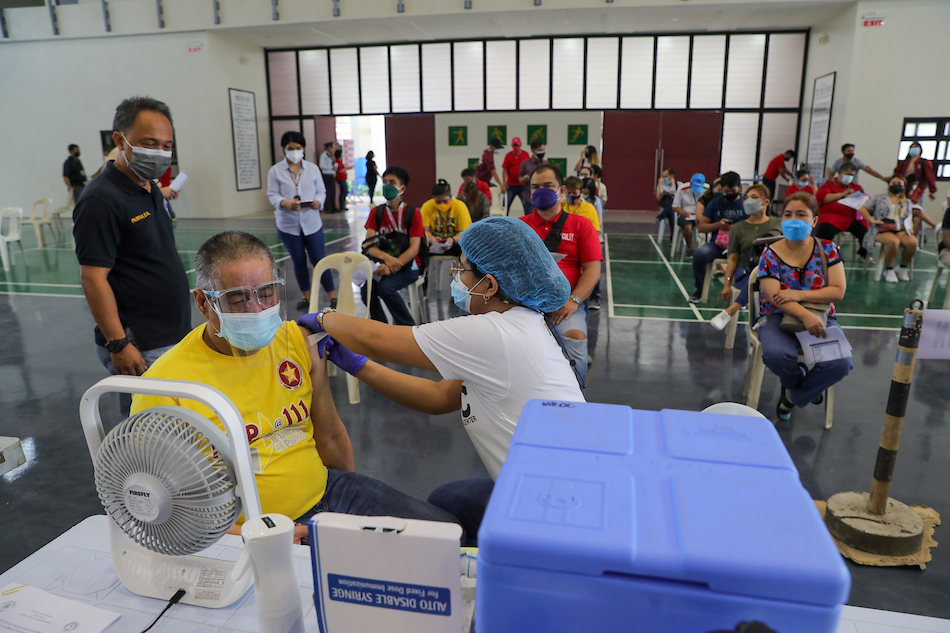 Manila Health Department (MHD) personnel administer COVID-19 vaccine to faculty and students of the Polytechnic University of the Philippines (PUP) in Sta. Mesa, Manila on February 11, 2022. Jonathan Cellona, ABS-CBN News