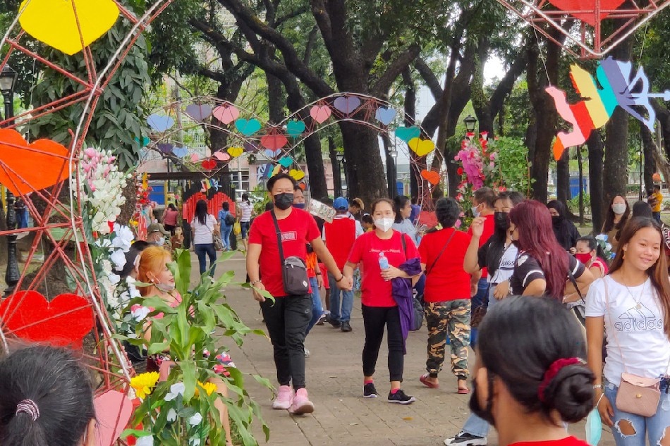 Valentine-themed displays decorate a walkway at the Rizal Park in Manila on Feb. 13, 2022, a day before Valentine's Day. Mark Demayo, ABS-CBN News