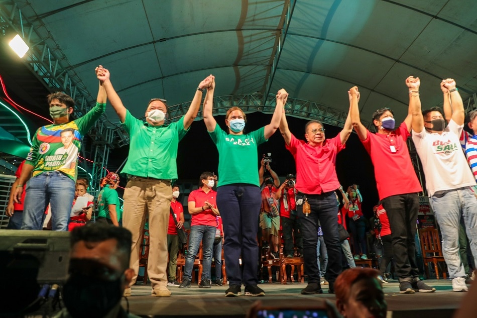 Halalan 2022 Presidential candidate Ferdinand Marcos Jr. (2nd from right), along with running mate Davao City Mayor Sara Duterte-Carpio (3rd from left), take the stage with senatorial candidates Robin Padilla (leftmost) and Harry Roque (2nd from left) and local government officials during a campaign rally in Narvacan, Ilocos Sur on February 17, 2022. Jonathan Cellona, ABS-CBN News