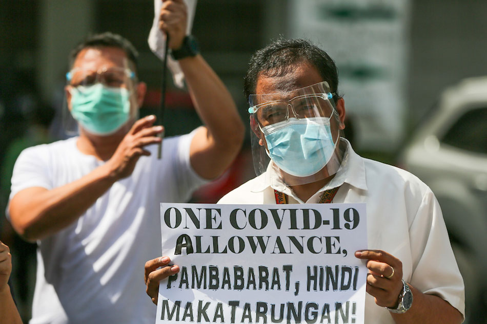  Health workers stage a lunch break picket at the Jose Reyes Memorial Medical Center in Manila on Monday. The group blast cutbacks in their COVID-19 benefits through the One COVID Allowance and called for a Php15,000 monthly special risk allowance (SRA) for all health workers.