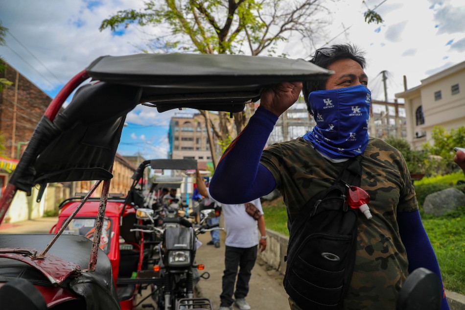 Tricycle driver Silverio Tamayo waits for passengers near the Ilocos Norte Provincial Capitol in Laoag City. He said he will vote for Bongbong Marcos because he is also an Ilokano. Jonathan Cellona, ABS-CBN News