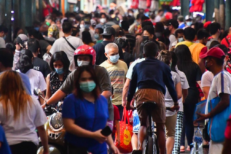 Market-goers navigate the Marikina Public Market on February 20, 2022. Mark Demayo, ABS-CBN News/file