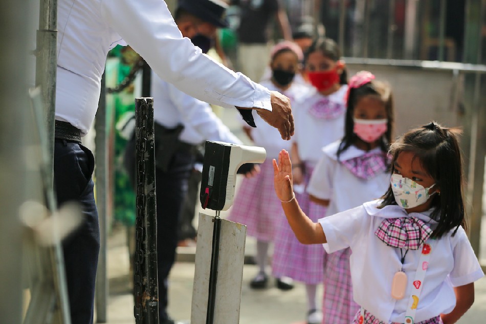Students observe safety protocol inside the Ricardo P Cruz St. Elementary School in Taguig City, during the first day of the pilot face-to-face classes in the National Capital Region on December 06, 2021. Jonathan Cellona, ABS-CBN News/File