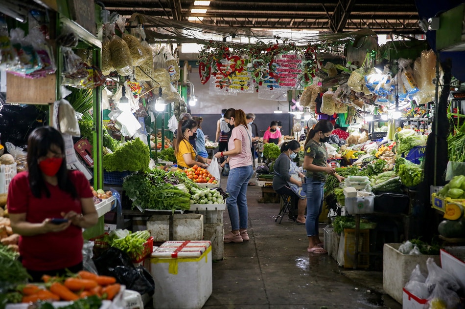 People visit the Farmers Market in Cubao, Quezon City on Feb. 19, 2022. George Calvelo, ABS-CBN News