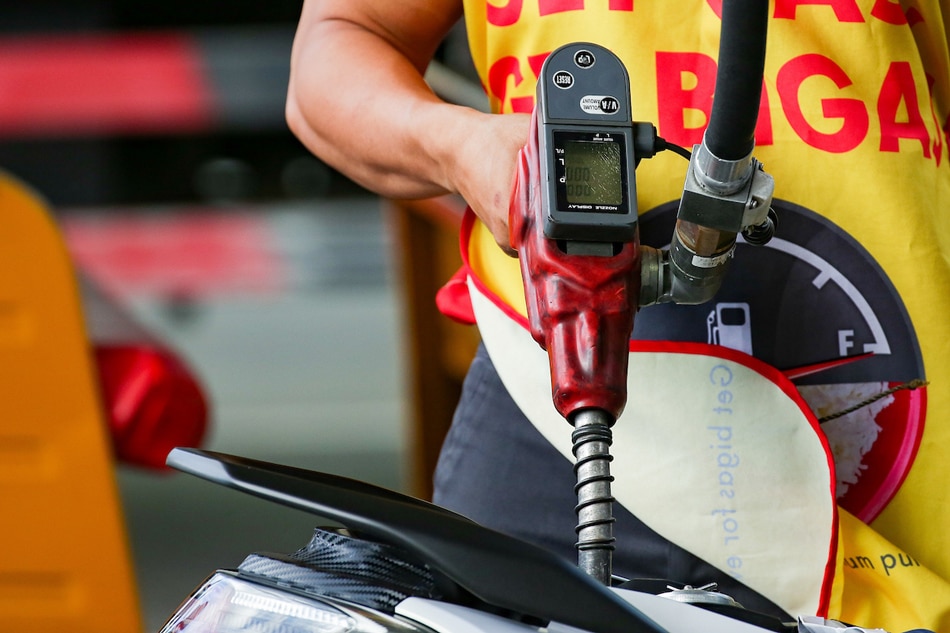  A motorcycle rider stops for a refill at a gasoline station in Manila on February 26, 2022. Gasoline prices which already increased for 8 straight weeks recently are expected to rise further amid the escalating conflict between Ukraine and Russia. George Calvelo, ABS-CBN News