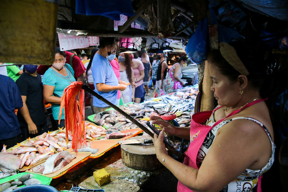 Members of urban poor group Kalipunan ng Damayang Mahihirap (Kadamay) hold a “price hike protest” at the San Roque Public Market in Quezon City on March 04, 2022. Jonathan Cellona, ABS-CBN News