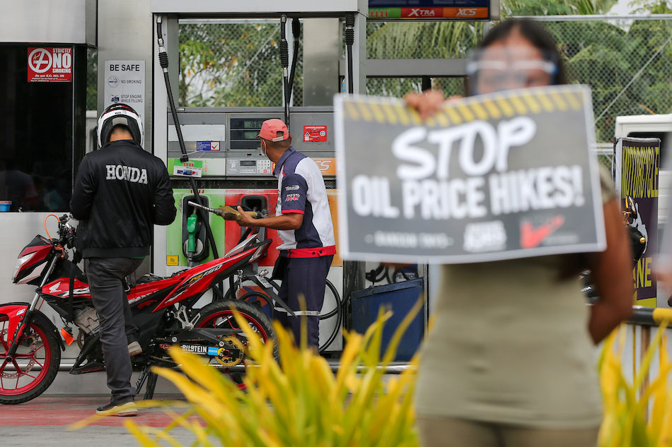 Defend Jobs Philippines holds a protest at a gas station on Commonwealth Avenue in Quezon City on March 02, 2021. The group urged the government to raise wages instead of hiking prices of fuel citing the challenges of the rising cost of living amidst a national public health emergency. Jonathan Cellona, ABS-CBN News 