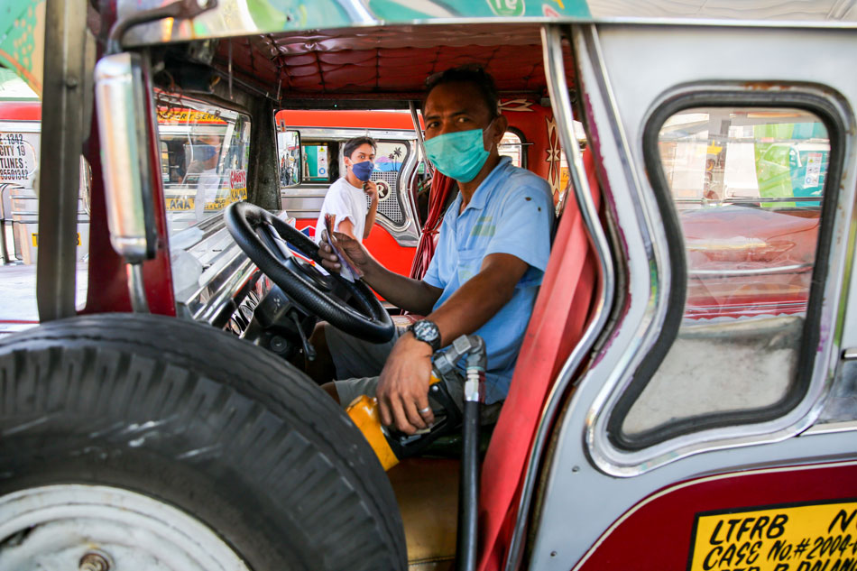 A jeepney driver refuels at a gasoline station in Manila on Feb. 28, 2022. Jonathan Cellona, ABS-CBN news