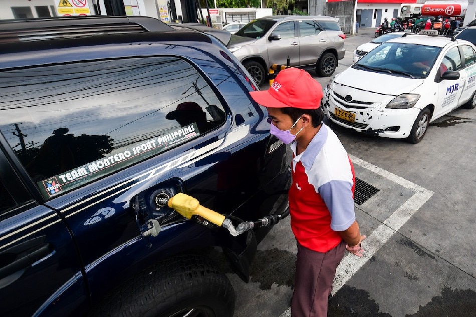 Motorists gas up at a Petro Gazz station in Cainta, Rizal on March 10, 2022, as the firm rolled back their fuel prices amid rising fuel costs due to the Ukraine-Russia conflict. Fuel prices are expected to further increase the following week. Mark Demayo, ABS-CBN News