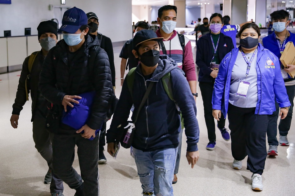 Filipino seafarers from Ukraine arrive at the Ninoy Aquino International Airport (NAIA) Terminal 1 on March 8, 2022. The twenty-one OFWs were evacuated from bulk carrier M/V S-Breeze at the Ilyichevsk Ship Yard in the Port of Odessa, Ukraine amid Russia’s invasion. George Calvelo, ABS-CBN News.