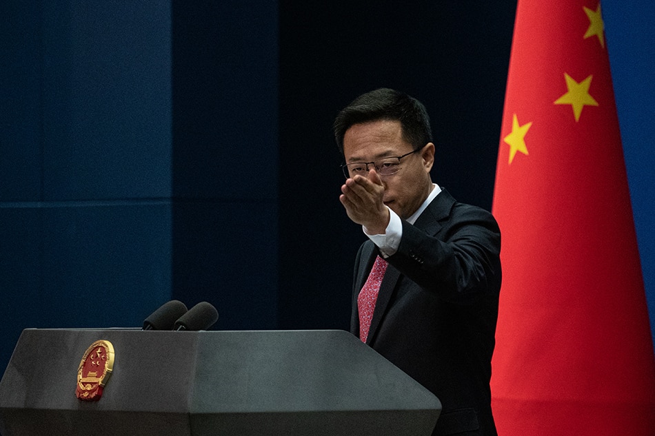 Chinese Foreign Ministry spokesman Zhao Lijian gestures during a daily media briefing in Beijing, China, 19 March 2021. EPA-EFE/ROMAN PILIPEY