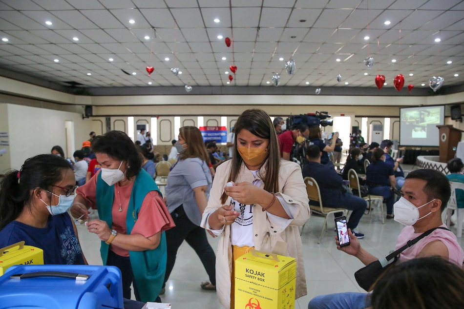 People receive their COVID-19 jabs during the National Vaccination Days part 4, at the Philippine Medical Association (PMA) headquarters in Quezon City on March 10, 2022. Jonathan Cellona, ABS-CBN News/File