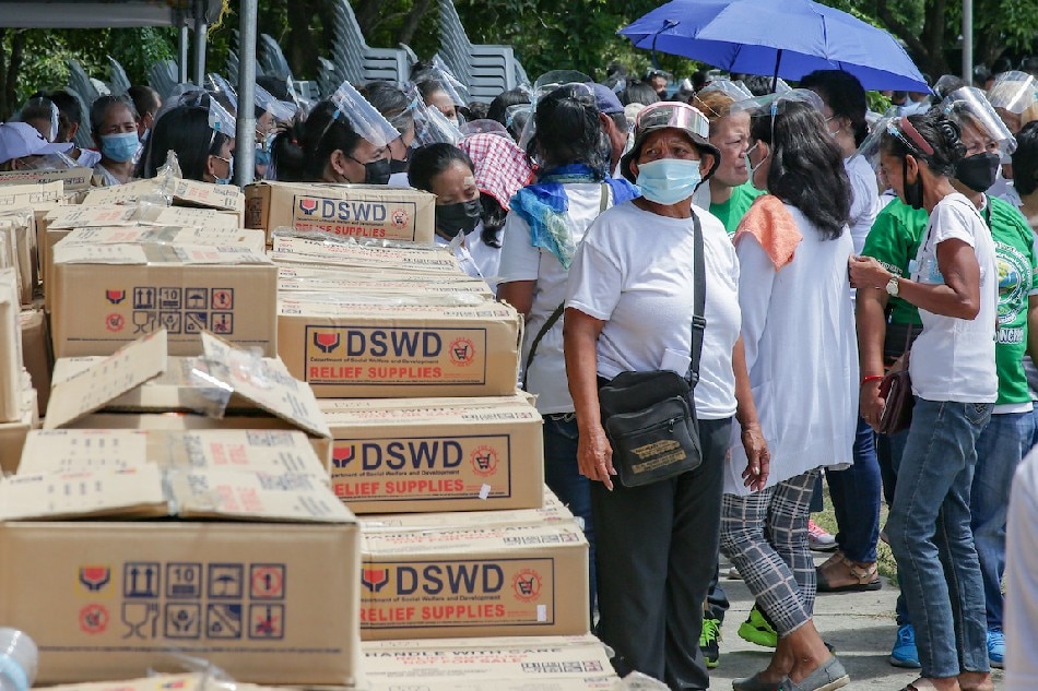 Beneficiaries wait to receive food packs during the “Duterte Legacy: Barangayanihan Caravan Towards National Recovery” held at the Camp Bagong Diwa in Taguig City on October 20, 2021. George Calvelo, ABS-CBN News