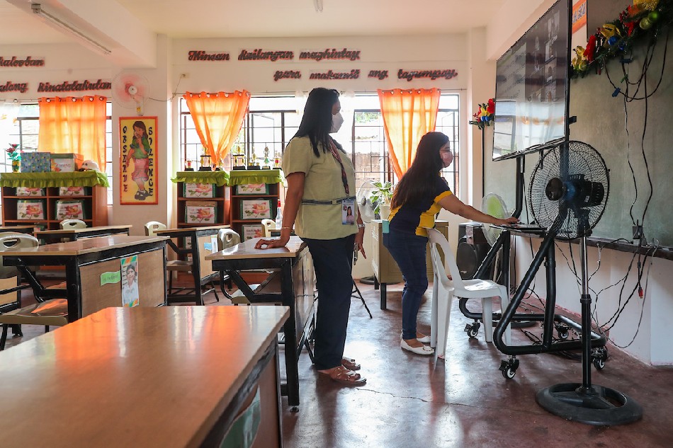 Teachers at the Ricardo P. Cruz Senior Elementary School in Taguig City on December 2, 2021. Jonathan Cellona, ABS-CBN News/File