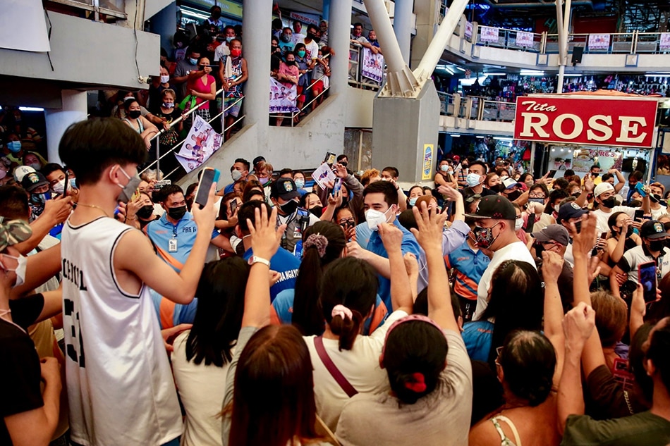 Pasig reelectionist Mayor Vico Sotto greets supporters during their proclamation rally inside the Pasig Mega Market on March 25, 2022. George Calvelo, ABS-CBN News