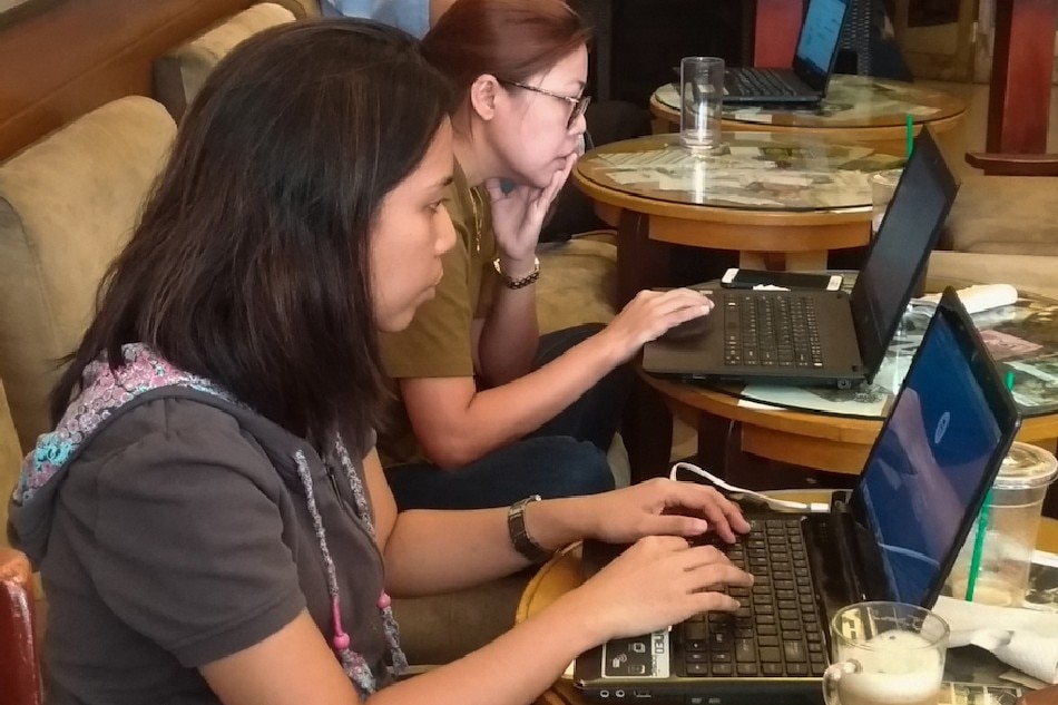 People doing remote work in a cafe in Quezon City on June 18, 2018. Mark Demayo, ABS-CBN News