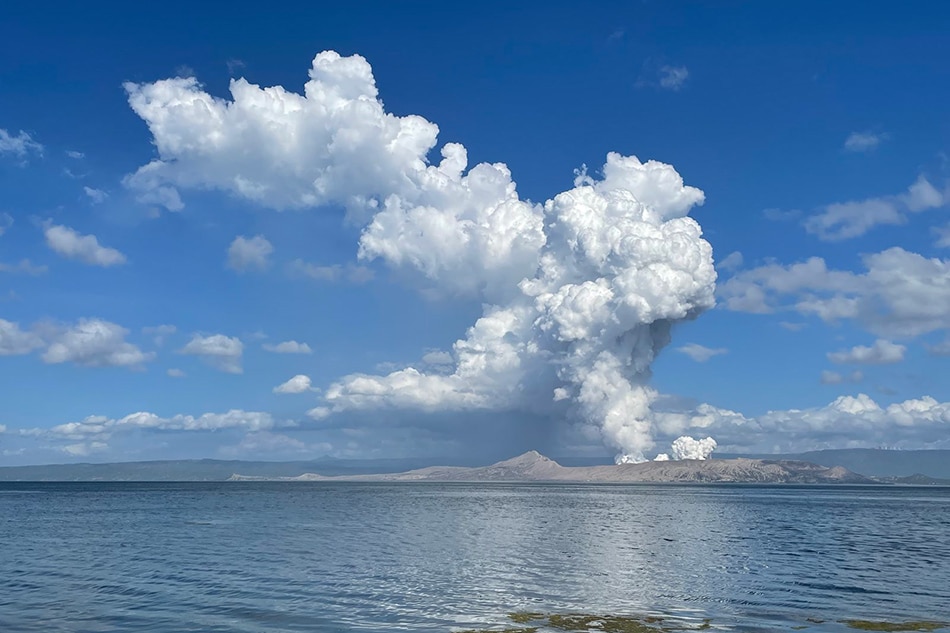 Taal Volcano in Batangas is seen from Lipa City emitting plumes after a phreatomagmatic burst in the morning of March 26, 2022, prompting the Phivolcs to place the volcano under Alert Level 3 due to magmatic unrest. Val Cuenca, ABS-CBN News