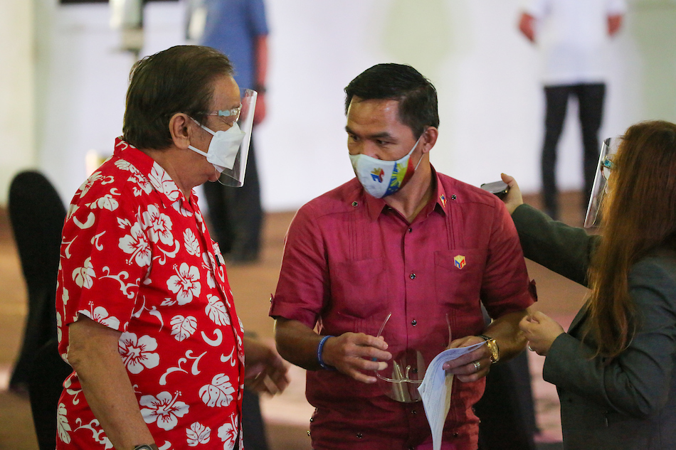 Senator Manny Pacquiao (right) and runningmate Lito Atieza before their filing of certificate of candidacies at the Sofitel tent on October 1, 2021. Mark Demayo, ABS-CBN News
