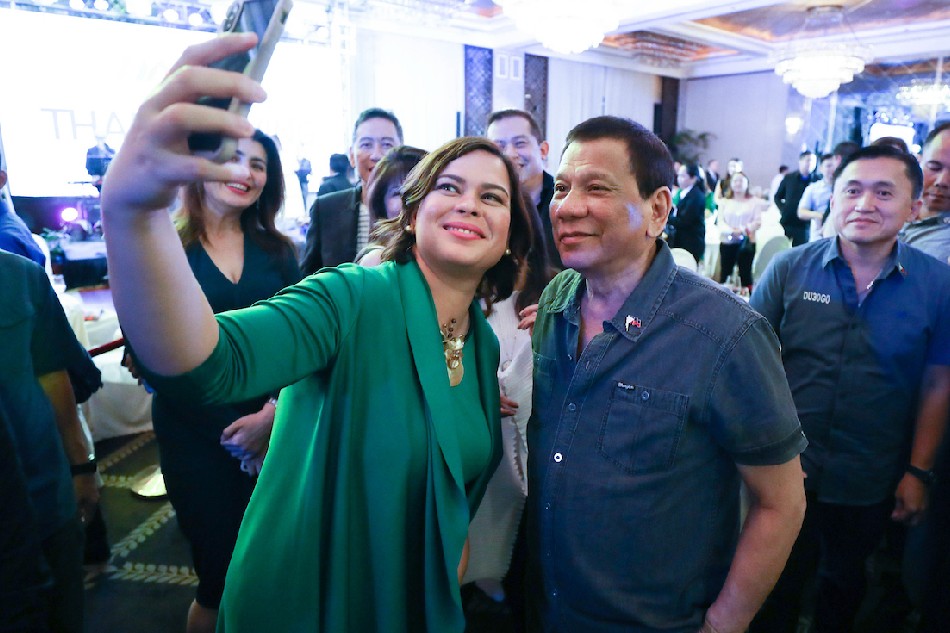 President Rodrigo Duterte poses for a photo with his daughter, Davao City Mayor Sara Duterte-Carpio during the Hugpong ng Pagbabago (HNP) Thanksgiving Night at the Peninsula Manila in Makati City on June 24, 2019. Karl Norman Alonzo, Presidential Photo/File 