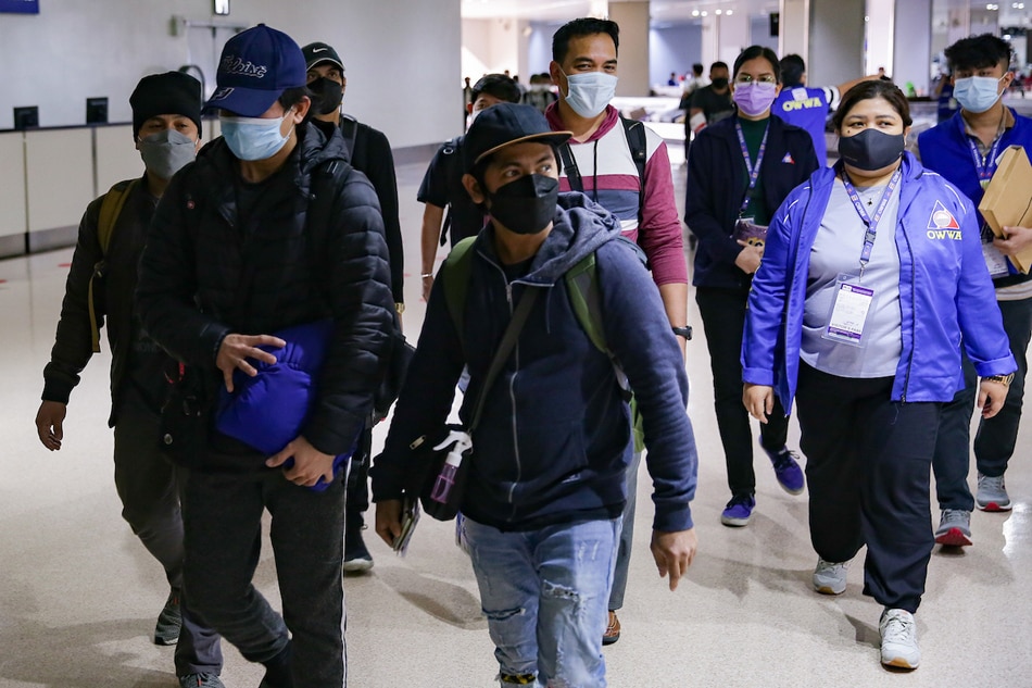 Filipino seafarers from Ukraine arrive at the Ninoy Aquino International Airport (NAIA) Terminal 1 on March 8, 2022. The 21 OFWs were evacuated from bulk carrier M/V S-Breeze at the Ilyichevsk Ship Yard in the Port of Odessa, Ukraine amid Russia’s invasion. George Calvelo, ABS-CBN News