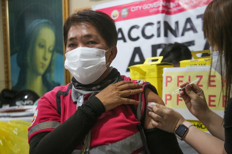 Residents receive their Covid19 jabs at the Saint Peter and John Parish in Malabon City on March 10, 2022 as the Department of Health continues its National Vaccination Days part 4 initiative to reach the places where there is low turn out for vaccinations. Jonathan Cellona, ABS-CBN News