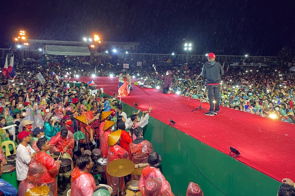 Despite rains brought by tropical storm Agaton, presidential candidate Bongbong Marcos speaks to the 120,000-strong crowd in Tacloban City on April 9, 2022. Ina Reformina, ABS-CBN News