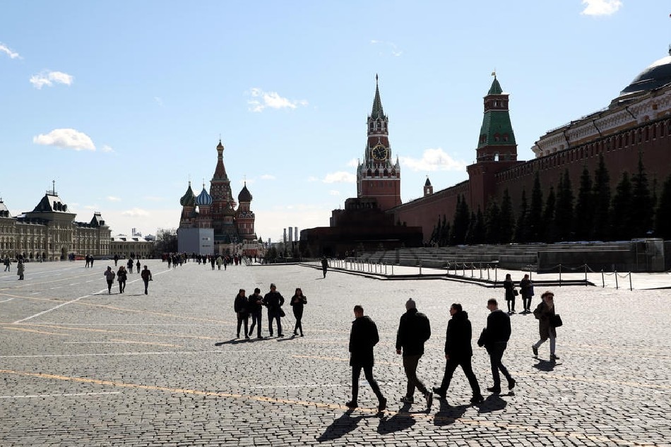 People walk in the Red Square outside the Kremlin in Moscow, Russia, April 6, 2022. Maxim Shipenkov, EPA-EFE